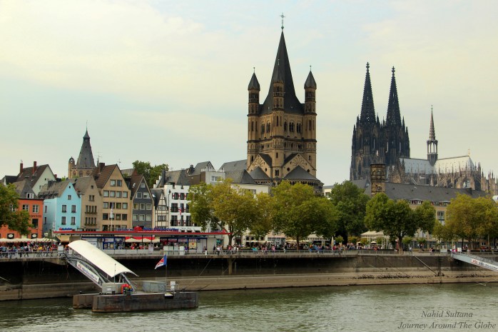 Cologne city from our cruise boat on River Rhine in Germany
