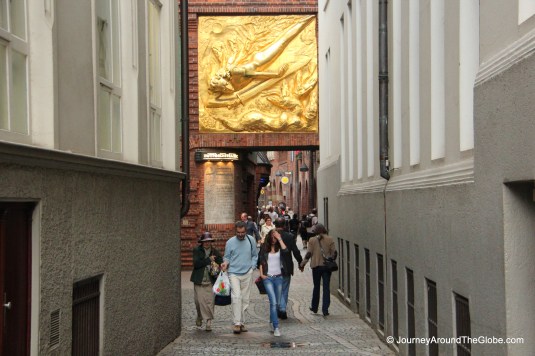 Entering Bottcherstrasse - a golden gilt adorning the gate, Bremen, Germany