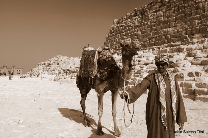 A random poser in Giza, who later asked for money since he posed for my camera and he was the one who kept insisting that I take picture of him and his camel