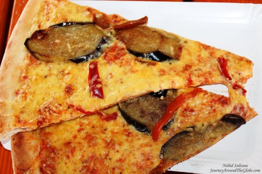 Our first lunch in Vienna, a slice of pizza from a train station - pizza with slices of egg-plant...still can taste it in my mouth