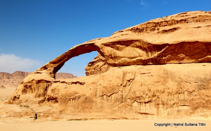 A natural rock bridge in Wadi Rum, Jordan