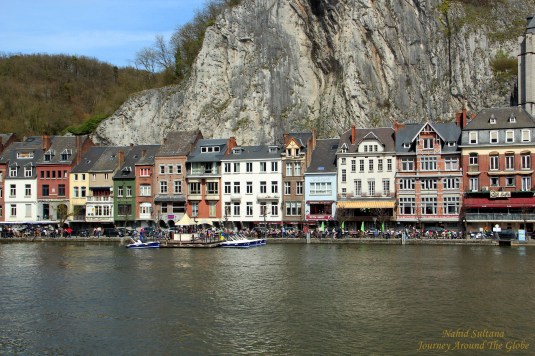 Old buildings by River Meuse in Dinant, Belgium