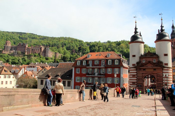 am Bruckentor (on the right), Heidelberg Castle on the hill on left...a view from Alte Brucke on River Necker in Heidelberg, Germany