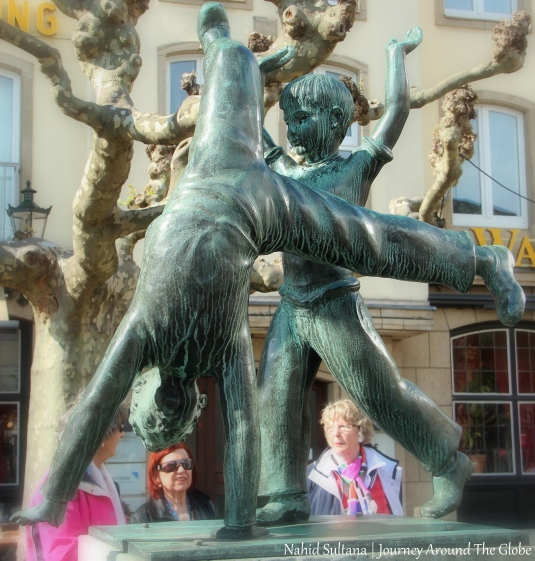Cartwheeling statue in Burgplatz of Dusseldorf, Germany