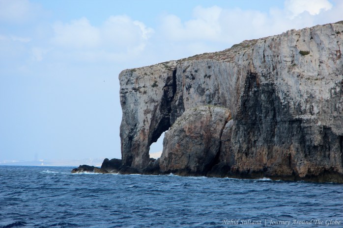 Elephant's trunk rock near Crystal Cave of Comino in Malta