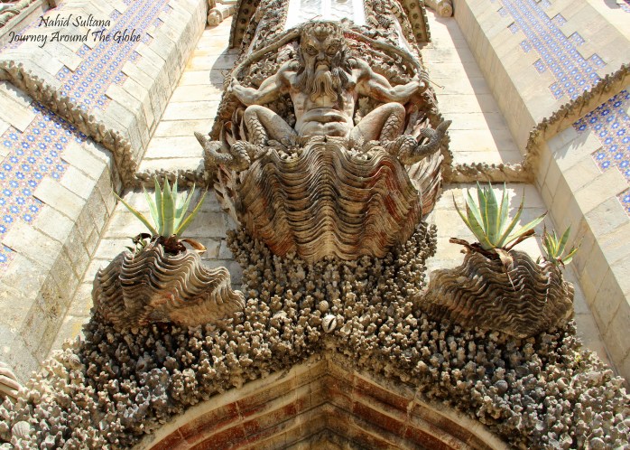 A half-man, half-fish figure on the main façade of Pena Palace in Sintra, Portugal