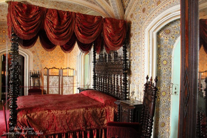Richly decorated queen's bedroom in Pena Palace in Sintra, Portugal