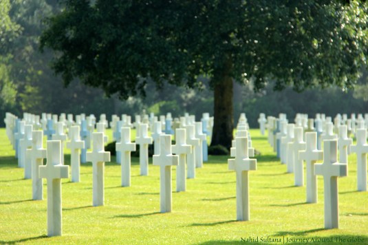 US soldiers in rest  in American Cemetery of WWII in Omaha Beach, France