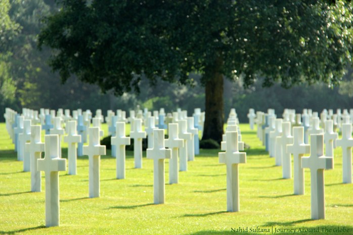 US soldiers in rest  in American Cemetery of WWII in Omaha Beach, France