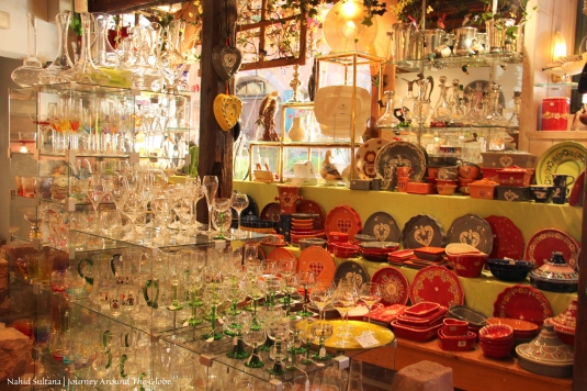 Alsatian potteries and typical looking wine glasses in a souvenir shop in Riquewihr, France