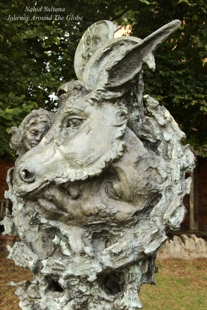 A statue depicting Shakespeare's "A Midsummer Night's Dream" in the garden of Nash's House and New Place in Stratford-Upon-Avon, England