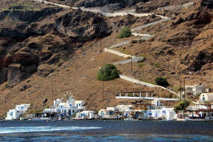 Harbor of Thirassia, you can see the white stairs going up the cliff