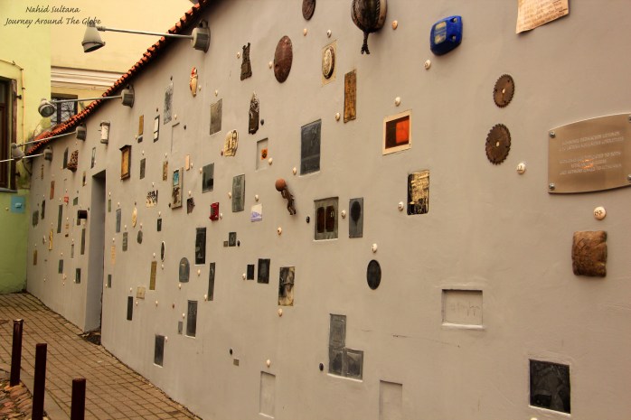 A wall in Literatu Street in Vilnius, Lithuania, decorated with many artworks 