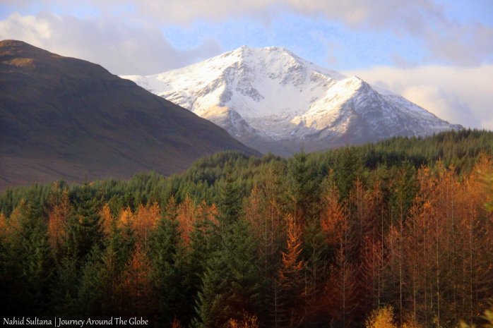 Passing by some snow-capped mountains in the Highlands