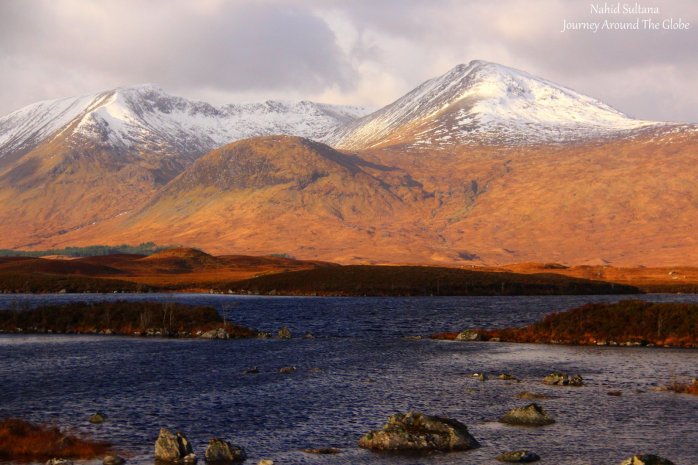 Driving by beautiful scenes of the Highlands in Scotland