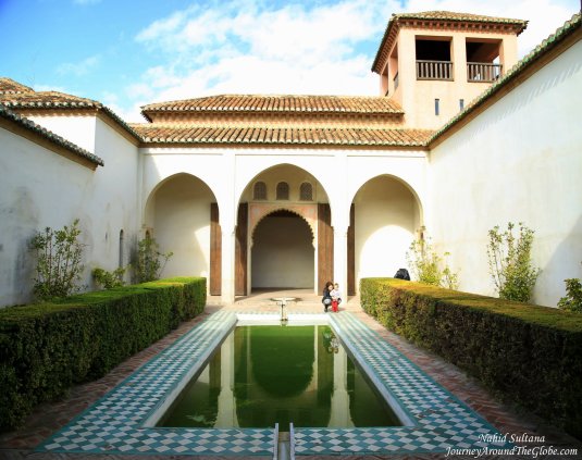 A patio with pool in Nasrid Palace of Alcazaba in Malaga, Spain