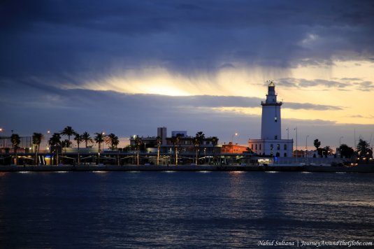 Lighthouse in Malaga Port before sunrise