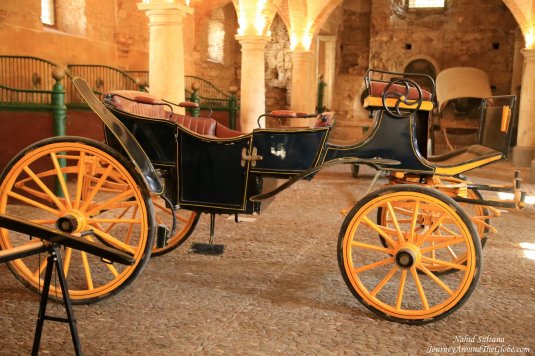 An old carriage inside the Royal Stable of Cordoba, in Spain