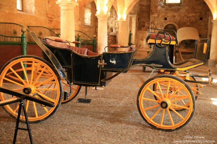 An old carriage inside the Royal Stable of Cordoba, in Spain