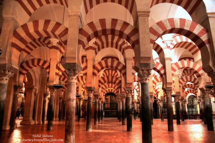 Red and white stripped arches of Mezquita - an original Moorish design from the 8th century