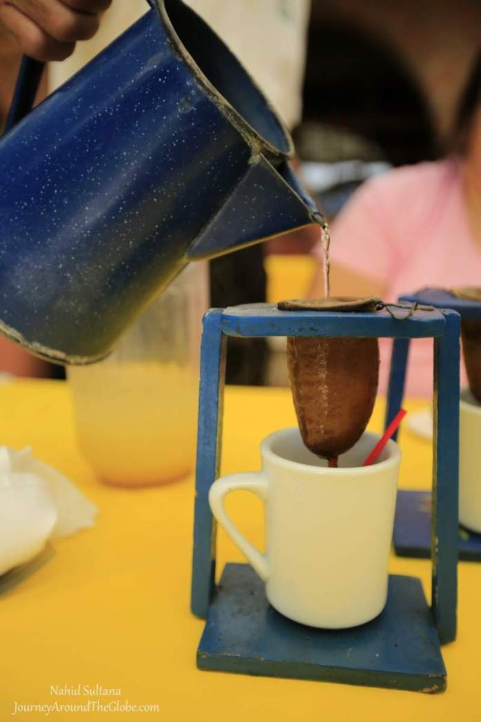 Pouring coffee Costa Rican style...you can also buy these pots from most of the souvenir stores in Costa Rica