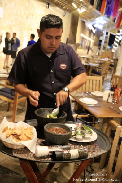 Our waiter making fresh guacamole for us in Fisherman's Landing in Cabo, Mexico